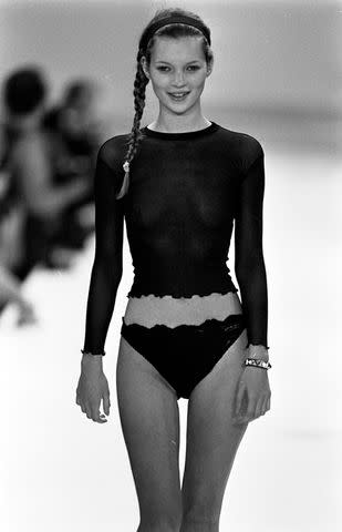 <p>George Chinsee/WWD/Penske Media/Getty</p> Kate Moss walking the runway for Calvin Klein in 1994, when thin was in.