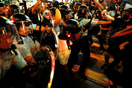 Riot police try to disperse anti-extradition bill protesters after a march at Hong Kong’s tourism district Nathan Road near Mongkok