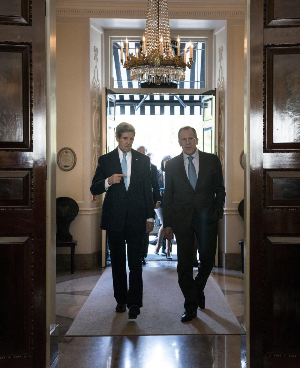 Russian Foreign Minister Sergei Lavrov (R) and U.S. Secretary of State John Kerry (L) walk together ahead of a meeting at Winfield House, the residence of the U.S. ambassador to the UK, in London on March 14, 2014. The United States and Russia launched a round of 11th-hour diplomacy just two days before Crimea votes to secede from Ukraine in a referendum that has sparked the biggest East-West showdown since the Cold War. (Photo credit should read BRENDAN SMIALOWSKI/AFP/Getty Images)