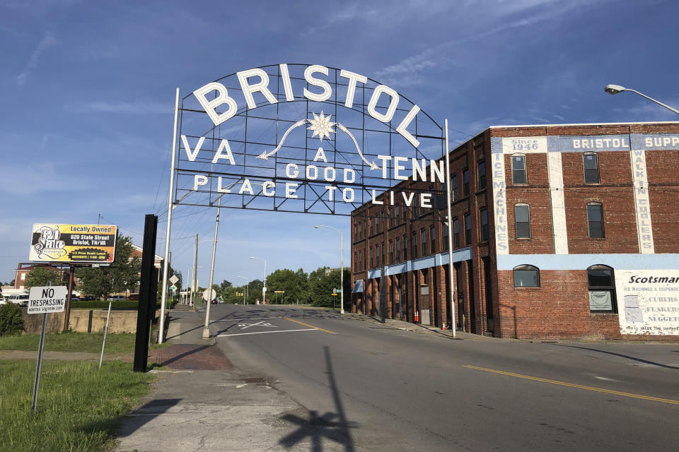 In this June 26, 2019 photo, A sign leading out of downtown Bristol, Va., a city that straddles two states, Tenn. and Va., is seen. Ten medical students were on a tour of the city organized by a medical school with the aim of luring them to practice in rural communities facing health care shortages after graduation. (AP Photo/Sudhin Thanawala)