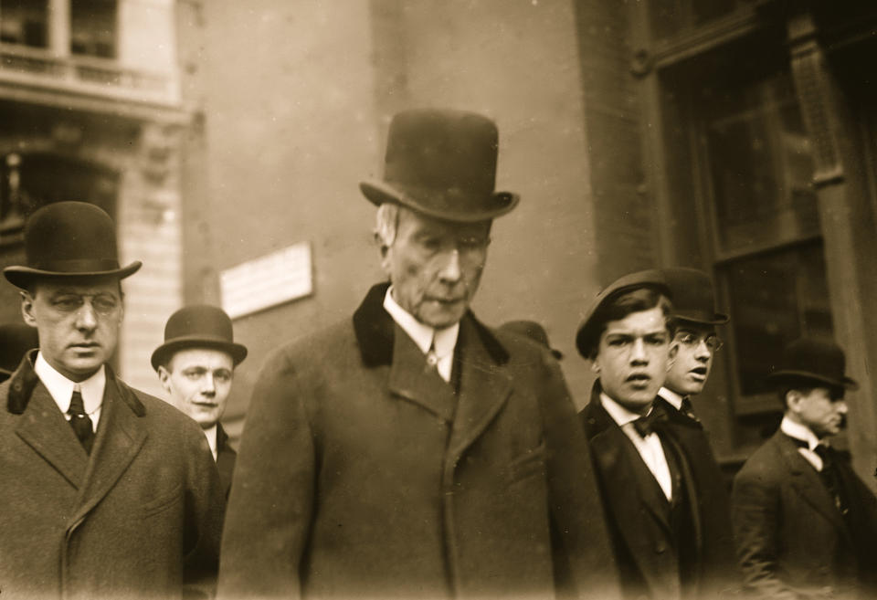 Standard Oil Company founder John Davison Rockefeller (1839 - 1937) walks on a New York city street amongst an unidentified group, 1908. (Photo by Buyenlarge/Getty Images)