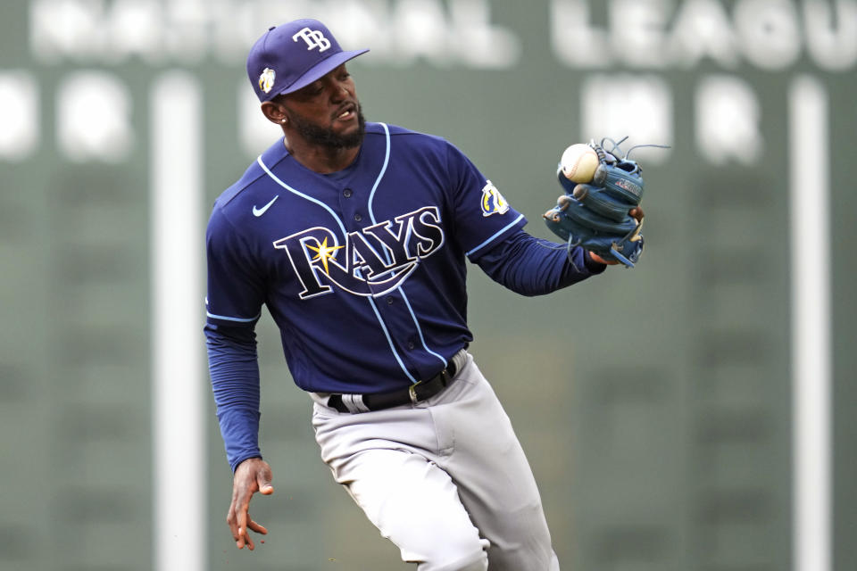 Tampa Bay Rays second baseman Vidal Brujan looks at the ball on the tip of his glove after a line-out by Boston Red Sox's Enrique Hernandez during the fourth inning of a baseball game at Fenway Park, Monday, June 5, 2023, in Boston. (AP Photo/Charles Krupa)