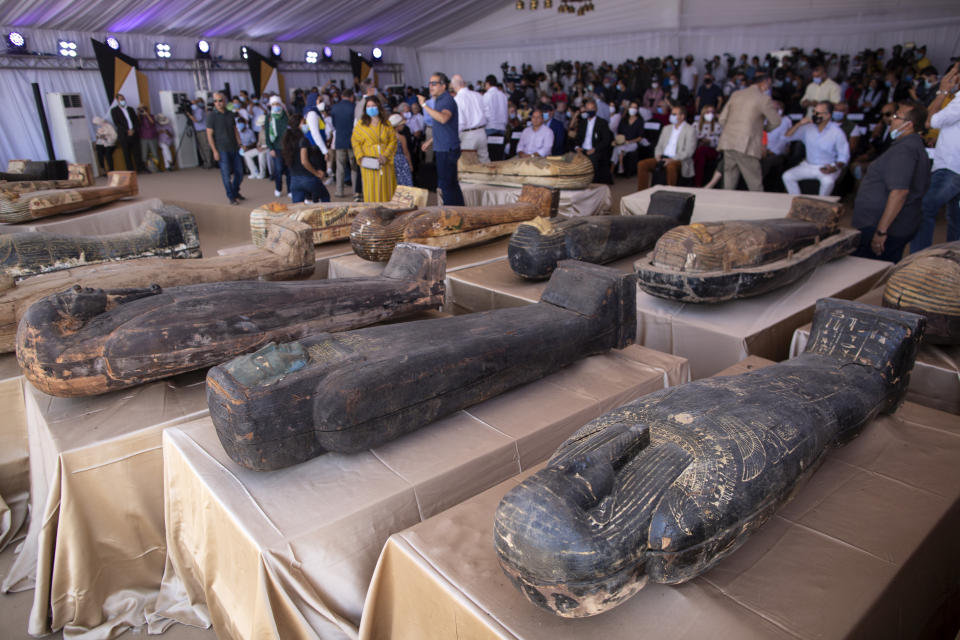 A sarcophagus that is around 2500 years old is displayed at the Saqqara archaeological site, 30 kilometers (19 miles) south of Cairo, Egypt, Saturday, Oct. 3, 2020. Egypt says archaeologists have unearthed about 60 ancient coffins in a vast necropolis south of Cairo. The Egyptian Tourism and Antiquities Minister says at least 59 sealed sarcophagi with mummies inside were found that had been buried in three wells more than 2,600 years ago. (AP Photo/Mahmoud Khaled)