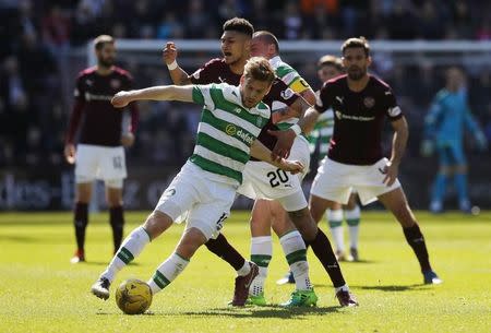 Britain Football Soccer - Heart of Midlothian v Celtic - Scottish Premiership - Tynecastle - 2/4/17 Celtic's Stuart Armstrong in action with Heart's Bjorn Maars Reuters / Russell Cheyne Livepic