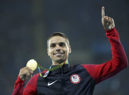 FILE PHOTO: 2016 Rio Olympics - Athletics - Victory Ceremony - Men's 1500m Victory Ceremony - Olympic Stadium - Rio de Janeiro, Brazil - 20/08/2016. Matthew Centrowitz (USA) of USA poses with his gold medal. REUTERS/Stoyan Nenov