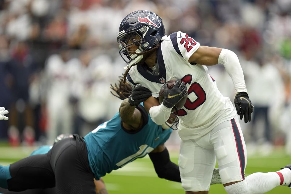 Houston Texans cornerback Vernon Hargreaves III (26) intercepts a pass against the Jacksonville Jaguars during the first half of an NFL football game Sunday, Sept. 12, 2021, in Houston. (AP Photo/Sam Craft)