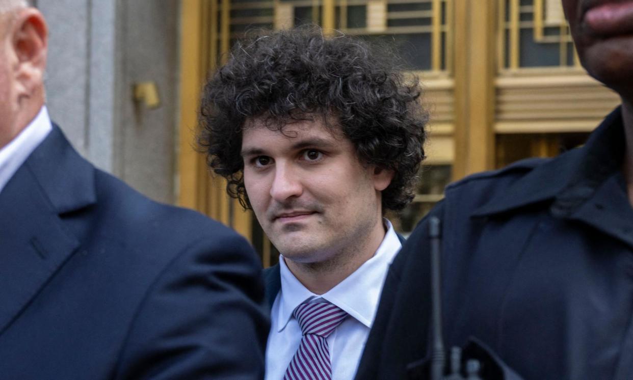 <span>Sam Bankman-Fried leaves the federal courthouse in New York City on 26 July 2023.</span><span>Photograph: Angela Weiss/AFP/Getty Images</span>