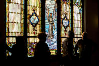 Stained glass projects calm over partitioners at Blue Jean Church in Selma, Ala., Sunday, Jan. 15, 2023, after a tornado caused major damage to the city days earlier. (AP Photo/Vasha Hunt)