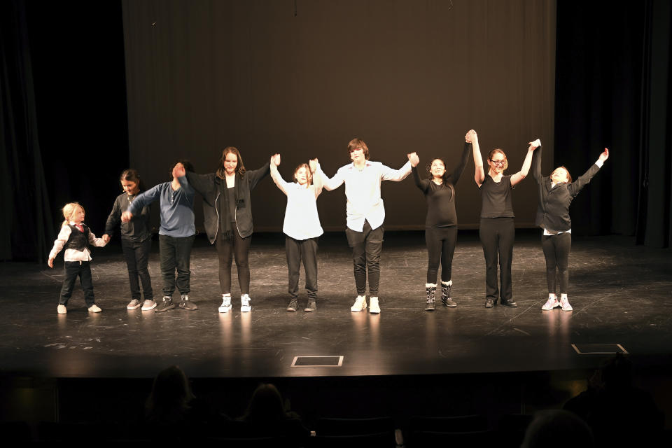 The cast of "The Bullying Collection" bows after performing the play at Wheatland High School in Wheatland, Wyoming on Friday, Jan. 12, 2024. School officials canceled the middle school play in part because it mentioned a gay character. The anti-bullying play was nonetheless performed under private sponsorship. (AP Photo/Thomas Peipert)