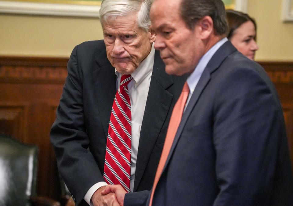 Barrington dentist Dr. Richard F. Gordon shakes hands with his lawyer, Robert Clark Corrente, after his acquittal Friday.