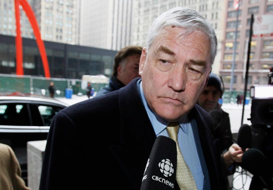 FILE - In this Jan. 13, 2011 file photo, Conrad Black arrives at the federal building in Chicago. President Donald Trump has granted a full pardon to Black, a former newspaper publisher who has written a flattering political biography of Trump. Black's media empire once included the Chicago Sun-Times and The Daily Telegraph of London. (AP Photo/Charles Rex Arbogast, File) ORG XMIT: WX115