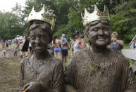 <p>Mackenna Kofahl, 10, left, and Brian Wilson, 10, poses after being named 2017 Queen and King of the annual Mud Day at the Nankin Mills Park, July 11, 2017, in Westland, Mich. (Photo: Carlos Osorio/AP) </p>