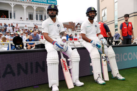 Cricket - England v India - Third Test - Trent Bridge, Nottingham, Britain - August 20, 2018 India's Virat Kohli and Cheteshwar Pujara before the start of play Action Images via Reuters/Paul Childs