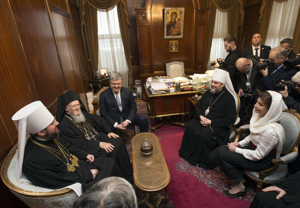 From left, Metropolitan Epiphanius, the head of the independent Ukrainian Orthodox Church, Ecumenical Patriarch Bartholomew I, Ukraine's President Petro Poroshenko, and his wife Maryna, sitting at right, talk at a meeting to sign "Tomos" decree of autocephaly for Ukrainian church at the Patriarchal Church of St. George in Istanbul, Turkey, Saturday, Jan. 5, 2019. (Mykhailo Markiv, Ukrainian Presidential Press Service/Pool Photo via AP)