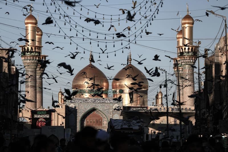 Iraqi Shiite Muslims gather in front of the shrine of Imam Musa al-Kadhim, the seventh Imam in Twelver Shia Islam who died at the end of the 8th century, during the annual commemoration of his death. Ameer Al-Mohammedawi/dpa