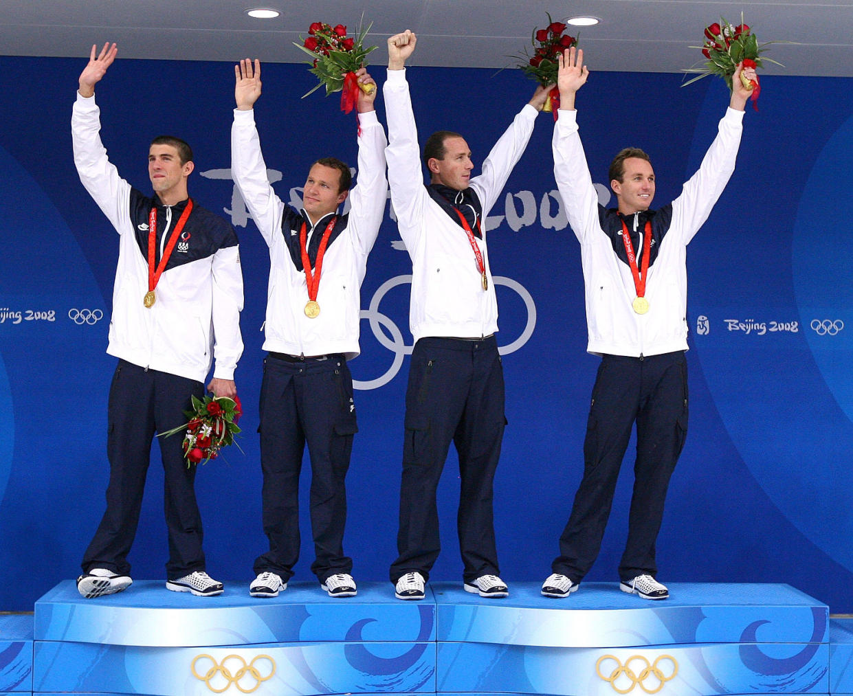 Michael Phelps, Brendan Hansen, Jason Lezak and Aaron Piersol on podium after winning Olympic gold medals in 2008. (Al Bello / Getty Images)