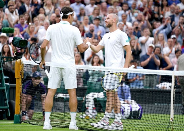 Roger Federer, left, was pushed all the way by Adrian Mannarino