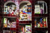 <p>The pantry of Antonia Casilla Guzman, 62. Guzman suffers from obesity and one of her daughters, has had a gastric bypass operation to lose weight. (Photograph by Silvia Landi) </p>