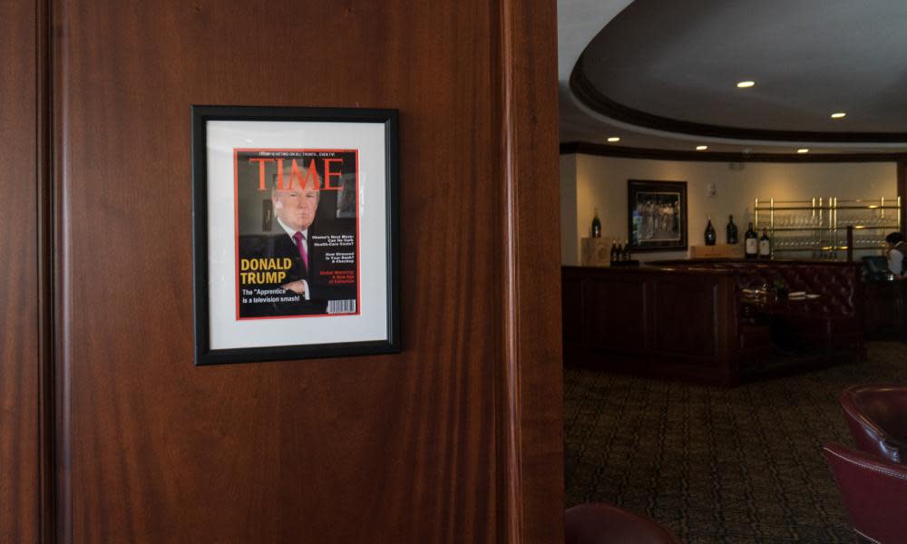 Framed portrait of President Donald Trump on the cover of a Time Magazine hanging from a column in the Champions Sports Bar & Grill at the Trump National Doral Miami.
