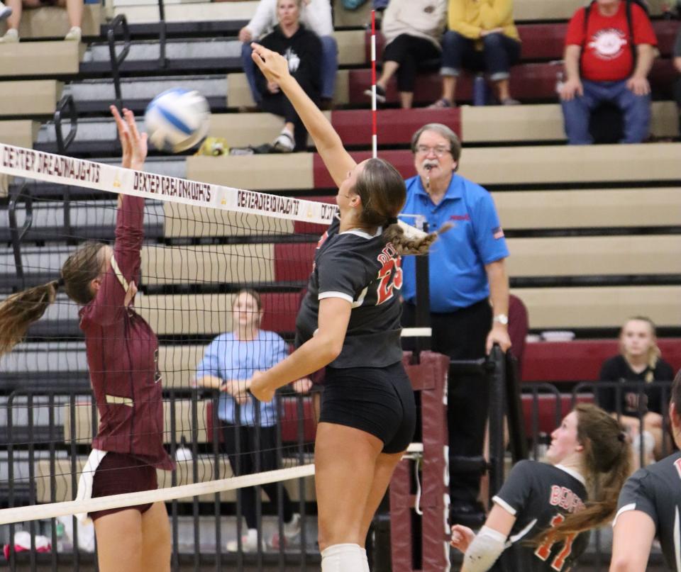 Victoria Gray slams down a kill for Bedford on an overpass during a win over Dexter Thursday night.