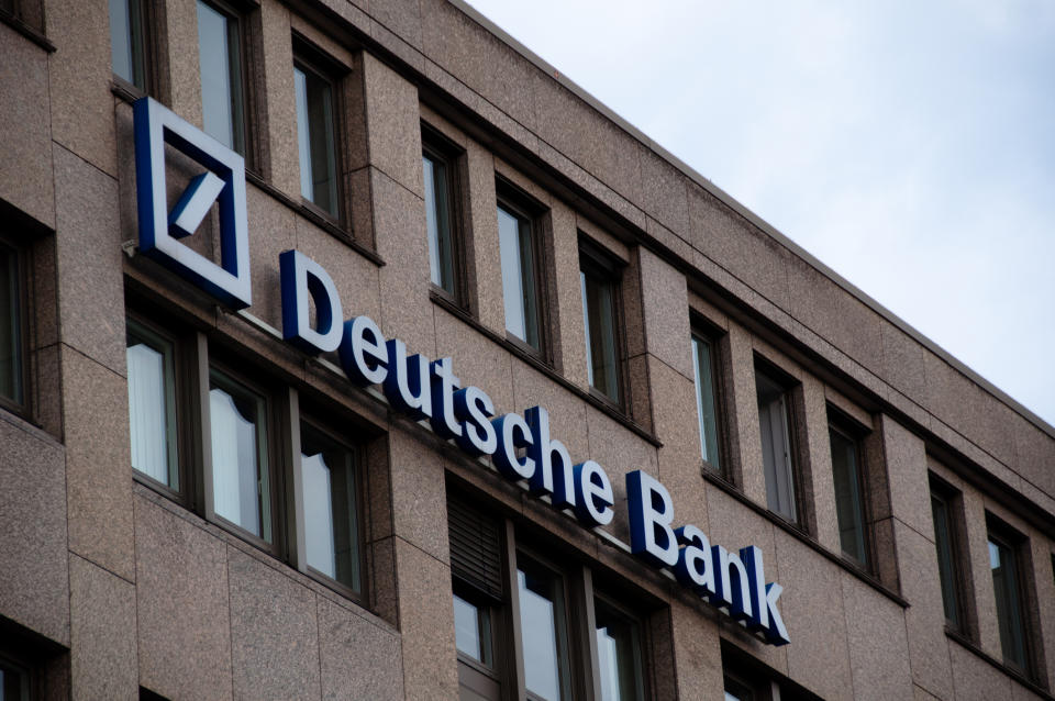 Deutsche Bank logo (neon sign) outside of office building in Stuttgart, Germany. Source: Getty Images