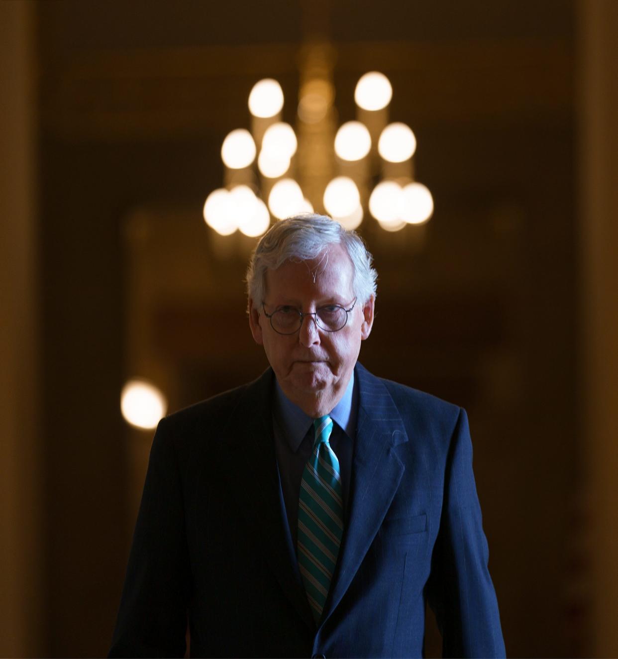 Senate Minority Leader Mitch McConnell, R-Ky., walks to the chamber for a vote, at the Capitol in Washington, Thursday, Oct. 7, 2021. Senate leaders announced an agreement to extend the government's borrowing authority into December, temporarily averting an unprecedented default that experts say would have decimated the economy. (AP Photo/J. Scott Applewhite) ORG XMIT: DCSA124