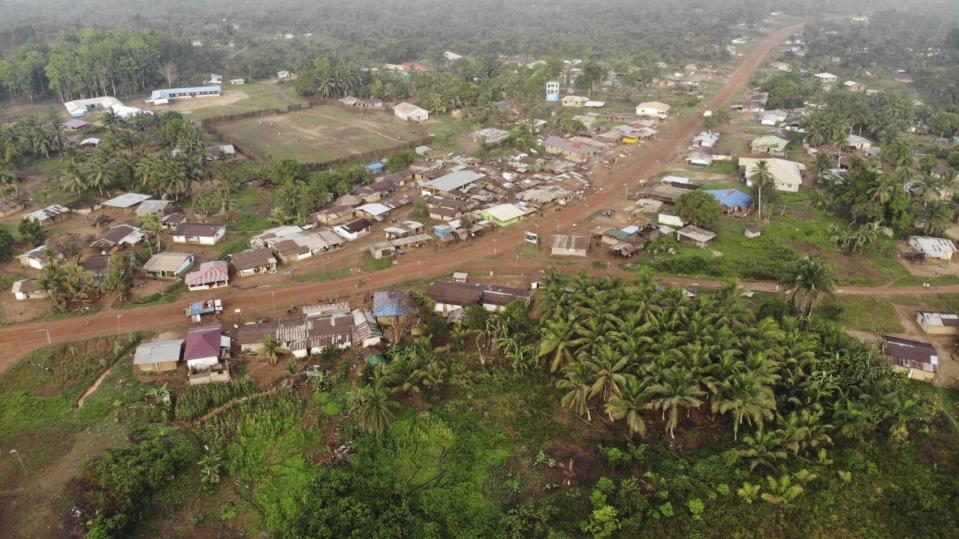 Yarkpa Town stands out in the surrounding rainforest in Rivercess County, Southeast Liberia, Wednesday, March 6, 2024. In the past year, the Liberian government has agreed to sell about 10% of the West African country's land — equivalent to 10,931 square kilometers (4,220 square miles) — to Dubai-based company Blue Carbon to preserve forests that might otherwise be logged and used for farming, the primary livelihood for many communities. (AP Photo/ Derick Snyder)