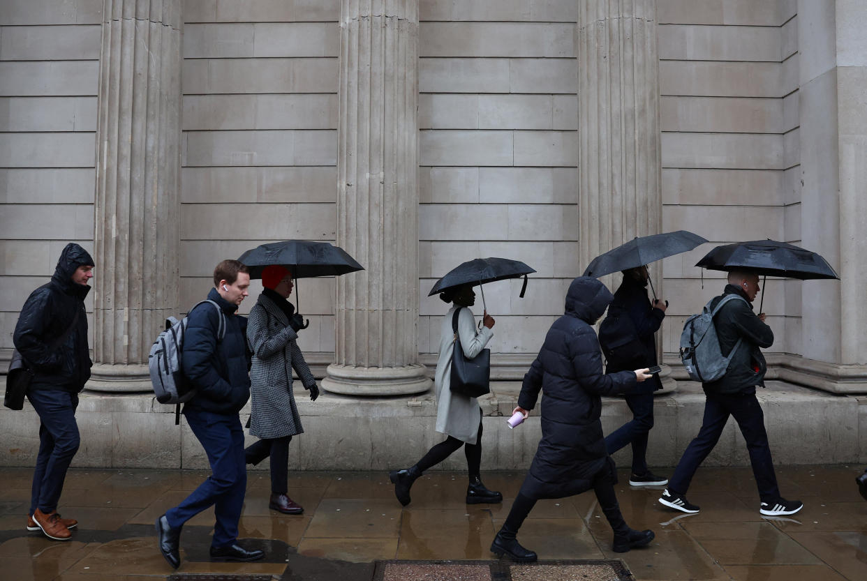 technical recession Commuters walk during the morning rush hour near the Bank of England in the City of London financial district in London, Britain, February 8, 2024. REUTERS/Toby Melville