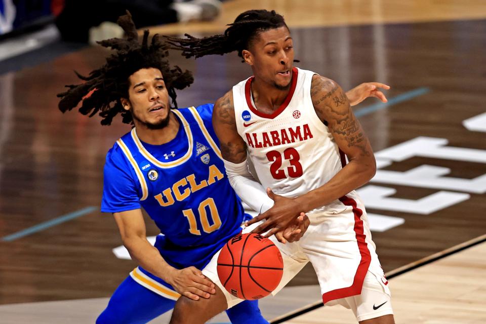 UCLA guard Tyger Campbell (10) steals the ball from Alabama guard John Petty Jr. (23) during their Sweet 16 game.