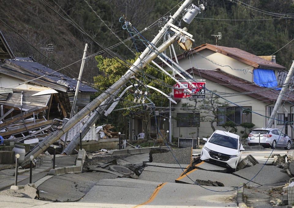 A road is damaged by Monday's earthquake in Wajima, Ishikawa prefecture, Japan Friday, Jan. 5, 2024. Monday’s temblor decimated houses, twisted and scarred roads and scattered boats like toys in the waters, and prompted tsunami warnings. (Kyodo News via AP)