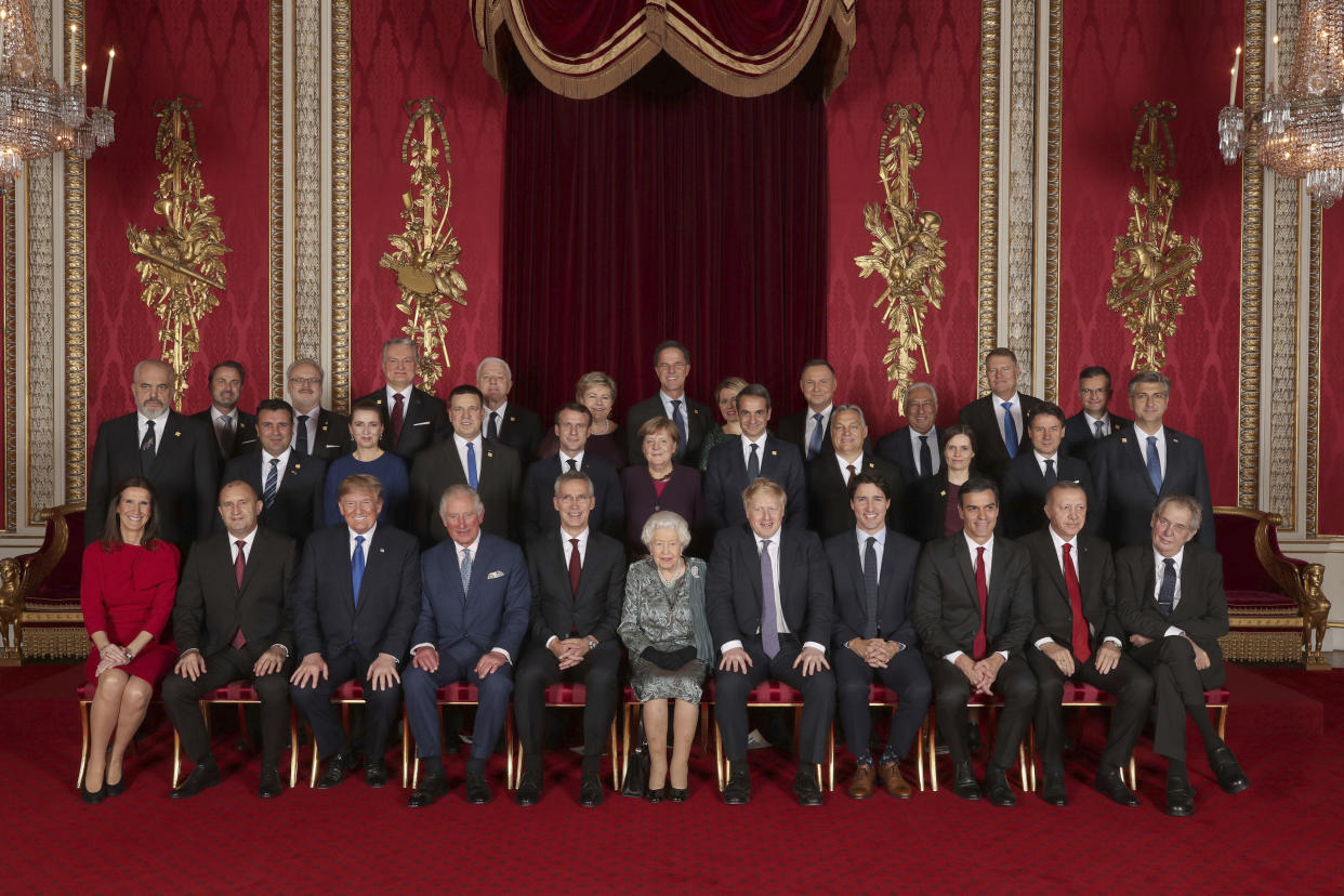 Leaders of the NATO alliance countries, and its secretary general, join Britain's Queen Elizabeth II and Prince Charles the Prince of Wales, for a group picture during a reception at Buckingham Palace in London, Tuesday Dec. 3, 2019, as they gathered to mark 70-years of the alliance. Back row, from left: Xavier Bettel Prime Minister of Luxembourg; Egils Levits President of Latvia; Gitanas Nauseda President of Lithuania; Dusko Markovic Prime Minister of Montenegro; Erna Solberg Prime Minister of Norway; Mark Rutte Prime Minister of Netherlands; Zuzana Caputova President of Slovakia; Andrzej Duda President of Poland; Antonio Costa Prime Minister of Portugal; Klaus Iohannis President of Romania; Marjan Sarec Prime Minister of Slovenia. Middle row from left: Edi Rama Prime Minister of Albania; Zoran Zaev Prime Minister of North Macedonia; Mette Frederiksen Prime Minister of Denmark; Juri Ratas Prime Minister of Estonia; Emmanuel Macron President of France; Angela Merkel President of Germany; Kyriakos Mitsotakis Prime Minister of Greece; Viktor Orban Prime Minister of Hungary; Katrin Jakobsdottir Prime Minister of Iceland; Giuseppe Conte Prime Minister of Italy; Andrej Plenkovic Prime Minister of Croatia. Seated from left: Sophie Wilmas Prime Minister of Belgium; Rumen Radev President of Bulgaria; Donald Trump President of United States; Prince Charles The Prince of Wales; Jens Stoltenberg NATO Secretary General; Queen Elizabeth II; Boris Johnson Prime Minister of the United Kingdom; Justin Trudeau Prime Minister of Canada; Pedro Sanchez Acting Prime Minister of Spain; Recep Tayyip Erdogan President of Turkey; Milos Zeman President of the Czech Republic. (Yui Mok/Pool via AP)