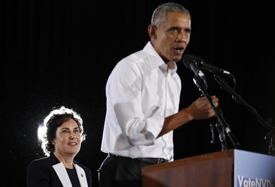 Candidate for Senate Jacky Rosen listens as former President Barack Obama speaks at a rally in support of her and other Democratic candidates, Monday, Oct. 22, 2018, in Las Vegas. (AP Photo/John Locher)