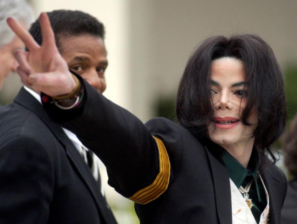 Michael Jackson waves to his supporters as he arrives for his child molestation trial at the Santa Barbara County Superior Court in Santa Maria, Calif. on March 2, 2005.