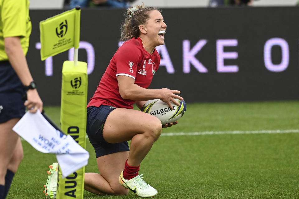 Claudia MacDonald of England celebrates after scoring a try during the Women's Rugby World Cup pool match between England and Fiji, at Eden Park, Auckland, New Zealand, Saturday, Oct.8. 2022. (Andrew Cornaga/Photosport via AP)
