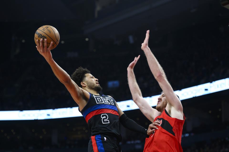 Detroit Pistons guard Cade Cunningham (2) shoots over Toronto Raptors center Jakob Poeltl (19) during the first half of an NBA basketball game in Toronto on Sunday, Nov. 19, 2023. (Christopher Katsarov/The Canadian Press via AP)