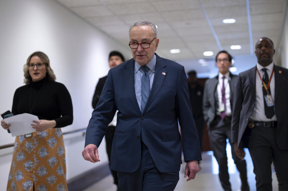 Senate Majority Leader Chuck Schumer, D-N.Y., walks to meet reporters to discuss next steps for the foreign aid package for Ukraine and Israel on the day after the bipartisan Senate border security bill collapsed, at the Capitol in Washington, Wednesday, Feb. 7, 2024. (AP Photo/J. Scott Applewhite)