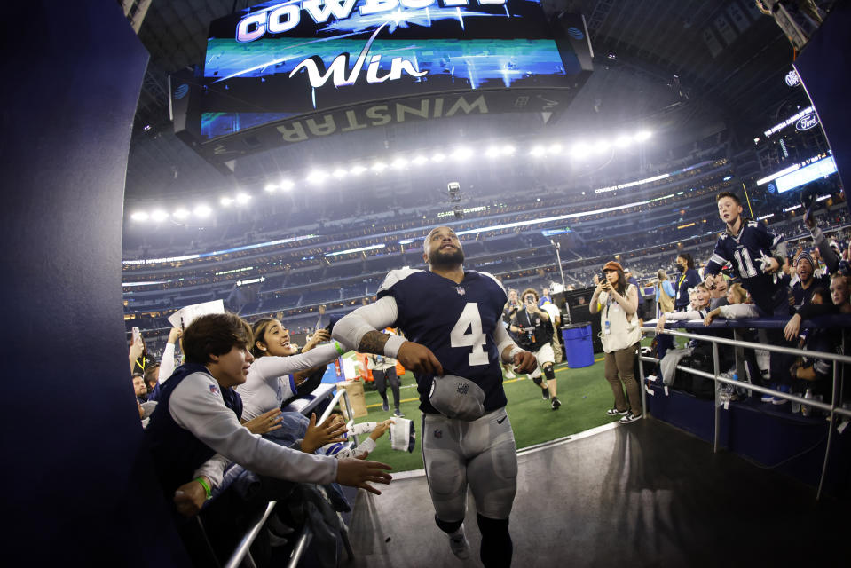 Dallas Cowboys quarterback Dak Prescott (4) runs off the field after an NFL football game against the New York Giants Thursday, Nov. 24, 2022, in Arlington, Texas. The Cowboys won 28-20. (AP Photo/Ron Jenkins)