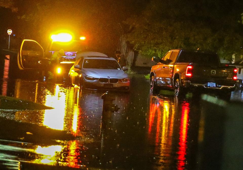 A stalled car is rescued after stalling in flooded Stockton streets during a severe storm.