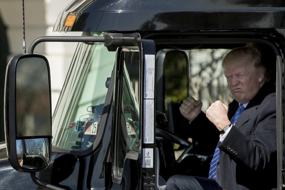 President Trump gestures in an 18-wheeler truck