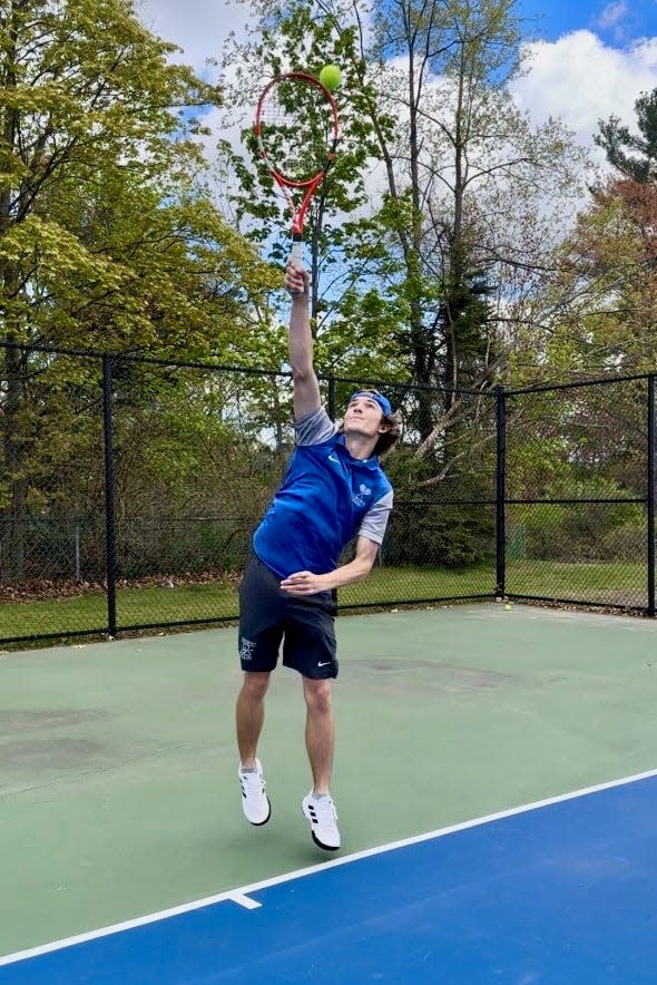 Auburn's Bryan Cavanaugh serves for the Rockets.