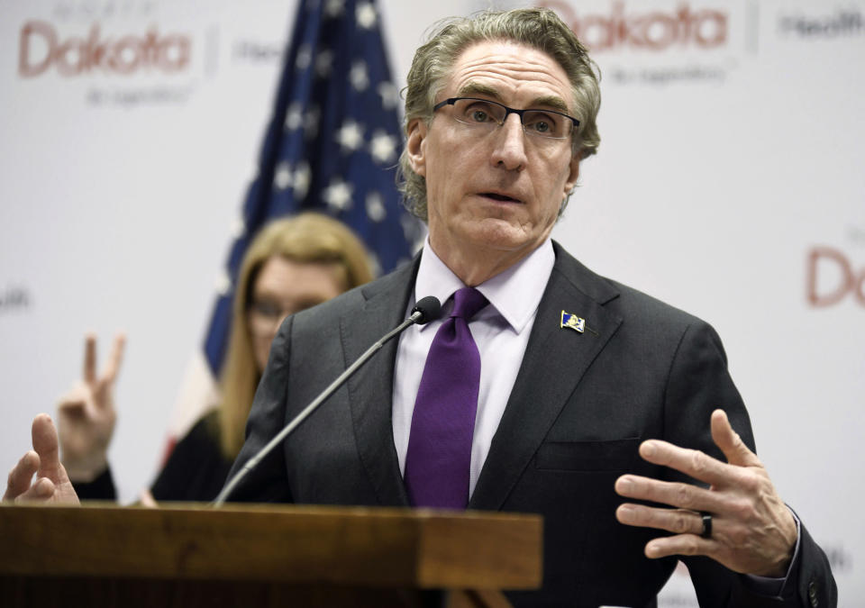 FILE - In this April 10, 2020, file photo, North Dakota Gov. Doug Burgum speaks at the state Capitol in Bismarck, N.D. North Dakota and South Dakota have the nation's worst rate of coronavirus deaths per capita in the last 30 days. Despite advances in treating coronavirus patients, hundreds more people in the Dakotas have died in recent weeks than during any other time of the pandemic. (Mike McCleary/The Bismarck Tribune via AP, File)