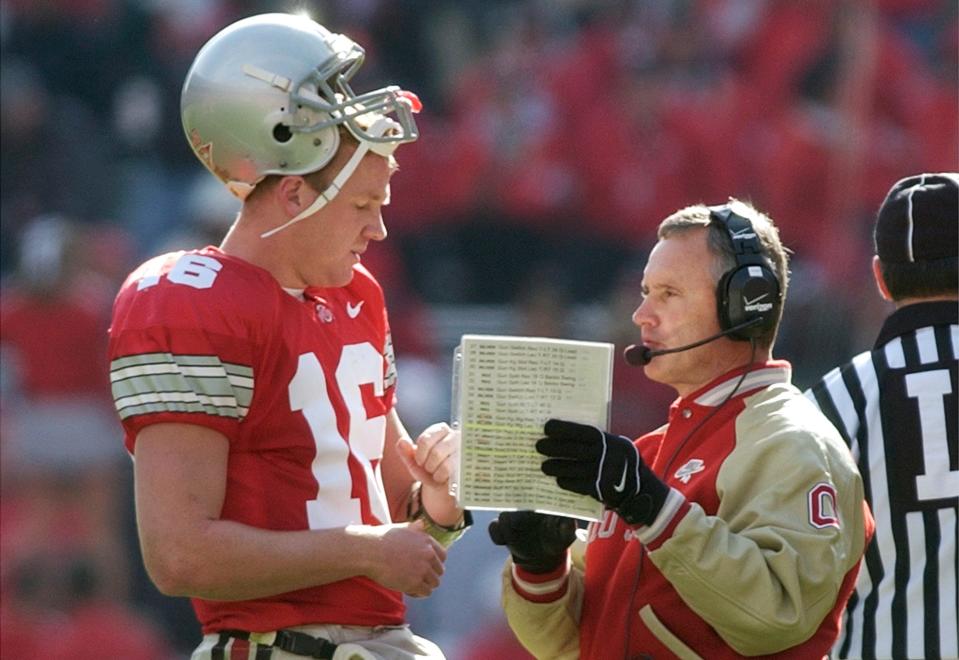 (HG OSUMSU 8NOV03) Ohio State's Craig Krenzel talks to head coach Jim Tressel in the first half of thier game at Ohio Stadium, November 8, 2003 . (Dispatch photo by Haraz Ganhbari)