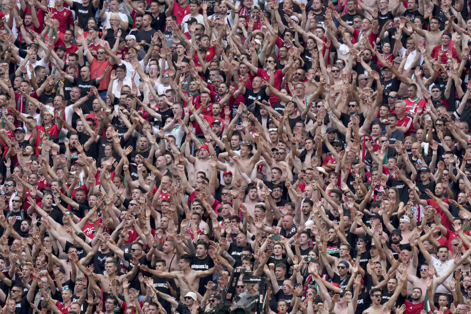 Hungarian fans follow the Euro 2020 soccer championship group F match between Hungary and France, at the Ferenc Puskas stadium in Budapest, Saturday, June 19, 2021. (AP Photo/Darko Bandic, Pool)