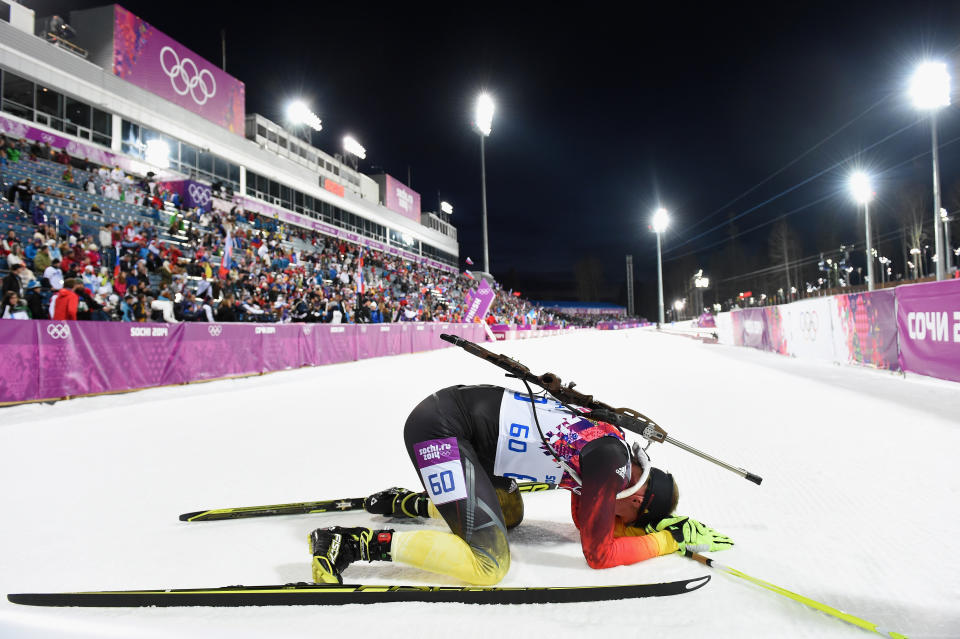 Daniel Boehm of Germany collapses in the snow after the Men's Individual 20 km during day six of the Sochi 2014 Winter Olympics at Laura Cross-country Ski & Biathlon Center on February 13, 2014 in Sochi, Russia. 