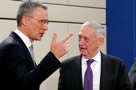 FILE PHOTO: NATO Secretary-General Jens Stoltenberg and U.S. Secretary of Defence Jim Mattis attend a NATO defence ministers meeting at the Alliance headquarters in Brussels, Belgium, February 15, 2018. REUTERS/Francois Lenoir/File Photo