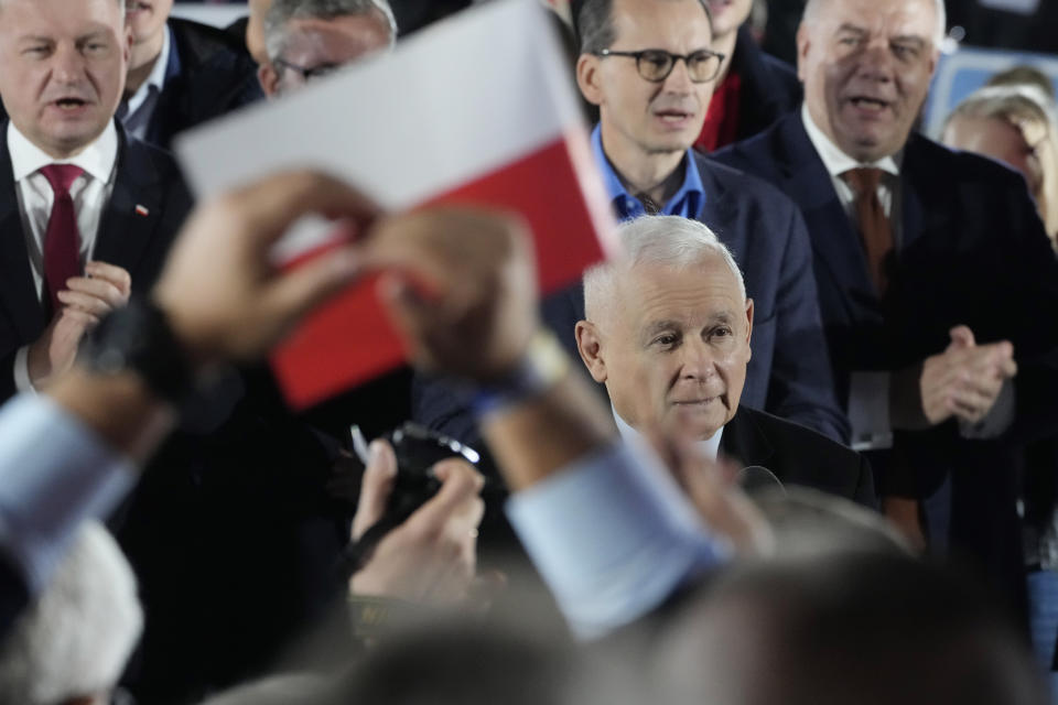 Poland's conservative ruling Law and Justice party leader Jaroslaw Kaczynski, center, speaks to supporters during the final campaign rally ahead of key parliamentary elections, in Sandomierz, Poland, on Friday, Oct. 13, 2023. At stake in Sunday's vote are the health of the nation's democracy, strained under the ruling conservative Law and Justice party, and the foreign alliances of a country on NATO's eastern flank that has been a crucial ally to Ukraine. The main challenger is centrist Civic Coalition. (AP Photo/Czarek Sokolowski)