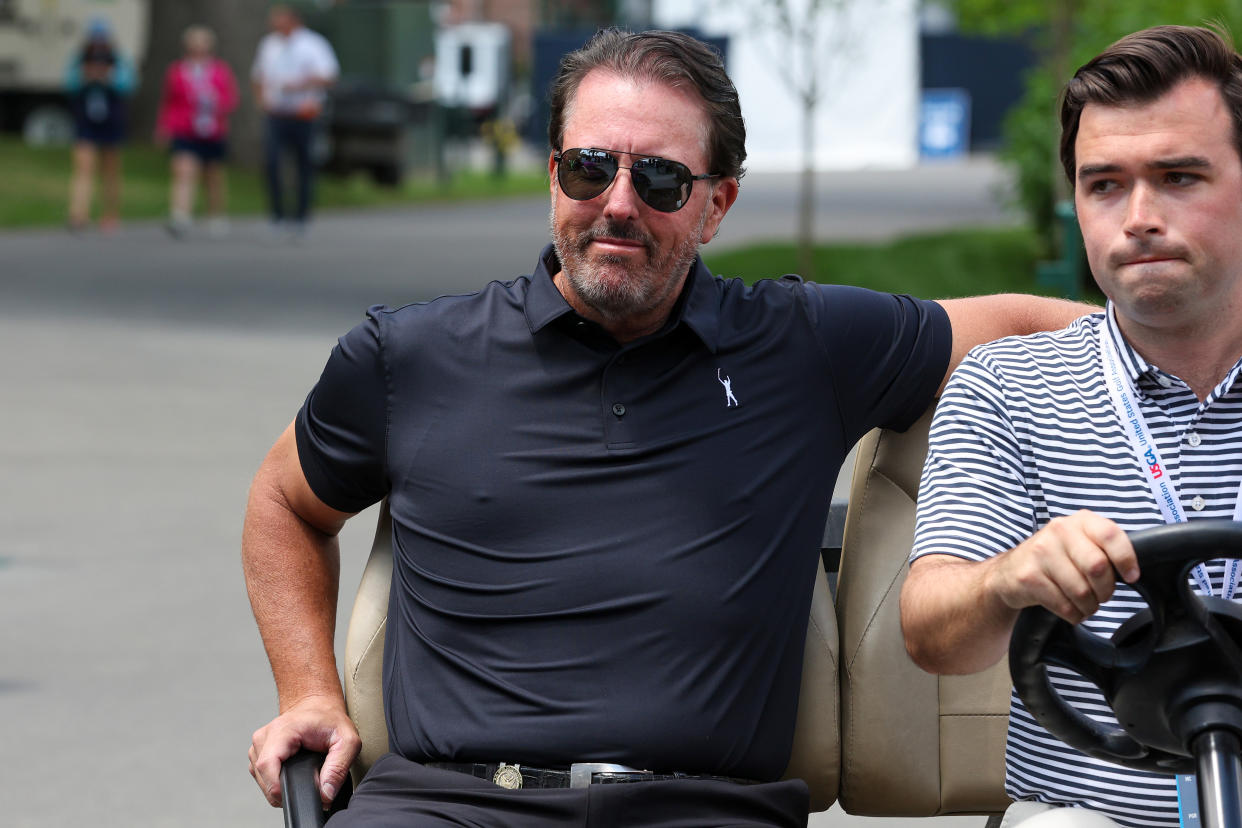 BROOKLINE, MASSACHUSETTS - JUNE 13: Phil Mickelson of the United States arrives in a golf cart to a press conference prior to the 2022 U.S. Open at The Country Club on June 13, 2022 in Brookline, Massachusetts. (Photo by Rob Carr/Getty Images)