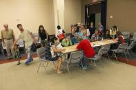 <p>Residents of the Marco Polo building register at a shelter for overnight accommodations after a deadly fire tore through the high rise building, Friday, July 14, 2017, in Honolulu, Hawaii. (Photo: Marco Garcia/AP) </p>