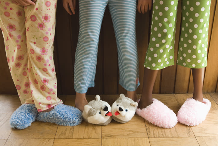 feet in different slippers