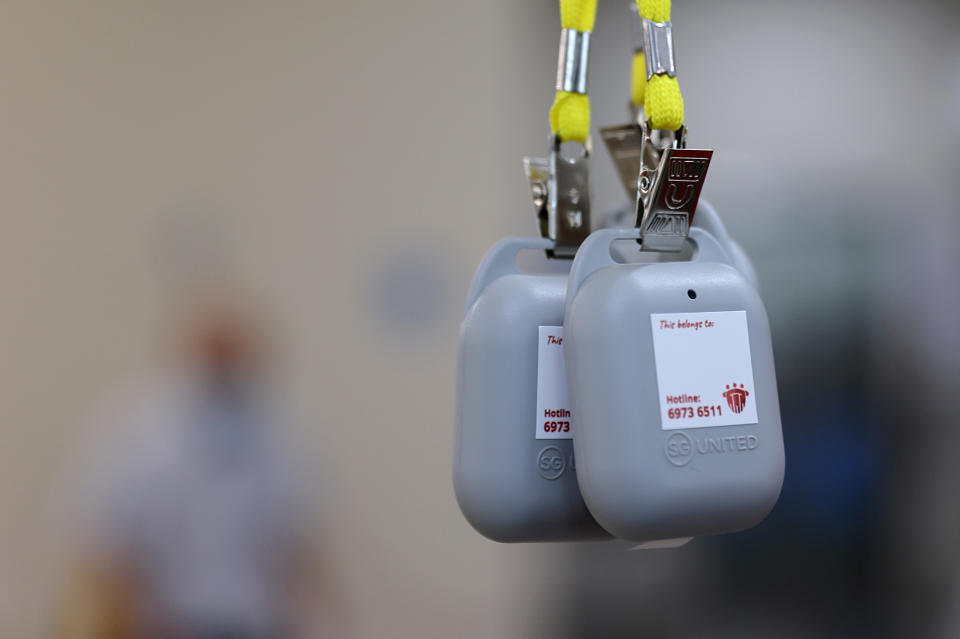 TraceTogether tokens in Singapore, part of a programme to control the spread of COVID-19. (PHOTO:Edgar Su/REUTERS)